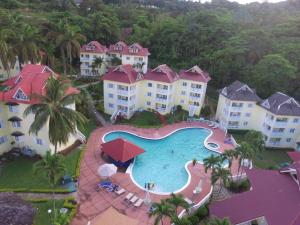an aerial view of a resort with a swimming pool at RIVER SIDE Apt 9 @ Mystic Ridge. in Ocho Rios