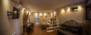a living room with a couch and a chair at CASA FRANCY in Castelmola