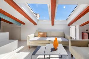 a living room with a couch and a table at Villa Homa in Dubrovnik