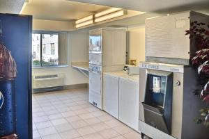 a large kitchen with white appliances and a window at Motel 6-Billings, MT - North in Billings