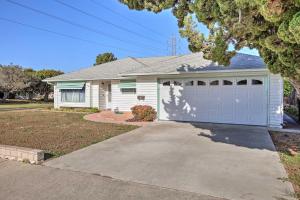 a white house with a garage and a driveway at Spacious House with Yard in SLO Wine Country! in San Luis Obispo