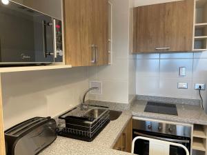 Kuchyň nebo kuchyňský kout v ubytování Apart Hotel Las Terrazas Suite