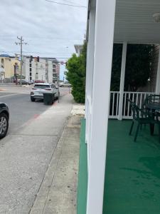 a house with a green painted sidewalk next to a street at Wilmington Terrace in Ocean City