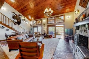 a living room with a couch and a fireplace at Norris Lake Escape in New Tazewell