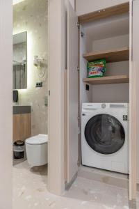 a washing machine in a bathroom with a toilet at Casa Costabella in Split