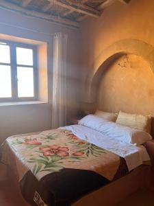 Katil atau katil-katil dalam bilik di Berberbayt lodge maison privé