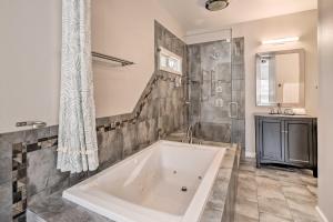 a large bathroom with a tub and a sink at Family Home in Walkable Area Near Silicon Valley! in Campbell +28 photos