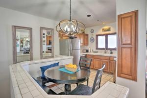 a kitchen with a table and a dining room at Quiet Avalon Getaway Villa with Ocean View and Balcony in Avalon