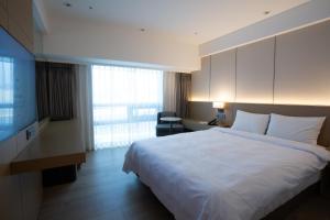 Ένα ή περισσότερα κρεβάτια σε δωμάτιο στο Hotel Interburgo Exco