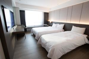 Ένα ή περισσότερα κρεβάτια σε δωμάτιο στο Hotel Interburgo Exco