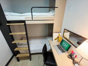 Postel nebo postele na pokoji v ubytování Formosa 101 Taipei Main Branch