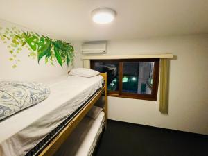 Postel nebo postele na pokoji v ubytování Rainbow Hostel