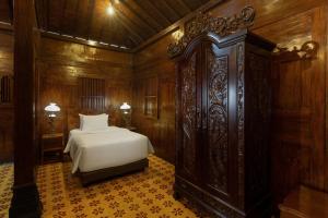 Un ou plusieurs lits dans un hébergement de l'établissement Bale Devata Resort
