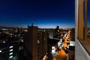 a view of a city at night with buildings at DIVA in Sapporo