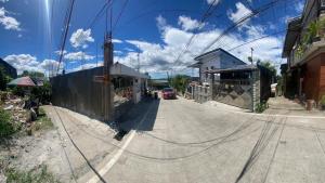 an empty street with a car driving down the road at San Jose del monte Bulacan gumaok with aircon unit 1 in Mangangpico