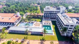 an aerial view of a building with a swimming pool at Goldi Sands Hotel in Negombo