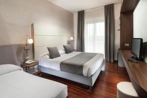 Кровать или кровати в номере Waldorf Palace Hotel