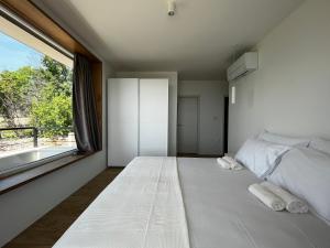 Ένα ή περισσότερα κρεβάτια σε δωμάτιο στο Villa Zara Bella Vista +28 φωτογραφίες