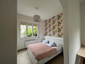 Postelja oz. postelje v sobi nastanitve Villa Silvia, indipendente con giardino privato e garage