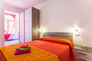 Postel nebo postele na pokoji v ubytování Nonna Adelina Apartments & rooms