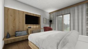 Llit o llits en una habitació de Dorf Hotel Grüner Baum