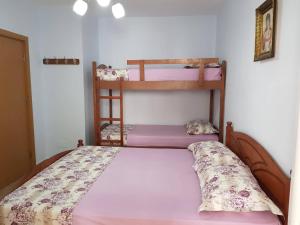 a bedroom with two bunk beds in a room at Seaside Nest Shengjin in Shëngjin