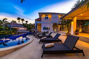 a villa with a swimming pool and a resort at 5 Bedroom Pool Villa Close To Town H5 in Hua Hin