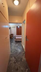 a room with a door and a room with a bed at Hotel Cosmos in Athens