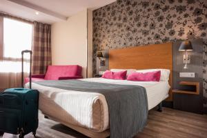 Postel nebo postele na pokoji v ubytování Hotel Regio Cádiz