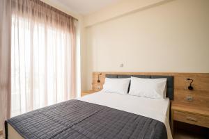 A bed or beds in a room at Villa MARIA