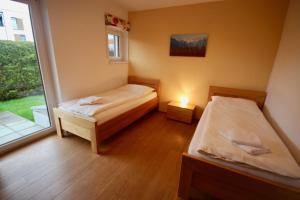 Łóżko lub łóżka w pokoju w obiekcie Appartements Julia