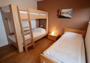 Łóżko lub łóżka w pokoju w obiekcie Appartements Julia