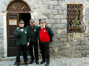 a group of three men standing in front of a building at B&B Palazzo Delogu in Osidda +11 photos