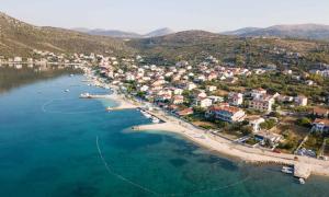 an aerial view of a beach with houses and the water at Sea View Apartment Sunrise Poljica & Blue Lagoon Rent A Boat in Poljica