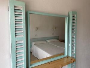 Postel nebo postele na pokoji v ubytování Hostal Roberto
