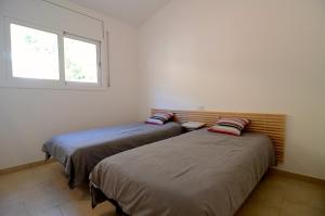 Postel nebo postele na pokoji v ubytování Montseny 3 - Piscina Privada