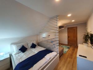 Posteľ alebo postele v izbe v ubytovaní Réteskert vendégház és apartman