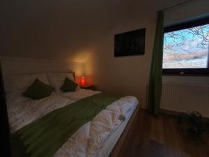 Posteľ alebo postele v izbe v ubytovaní Réteskert vendégház és apartman