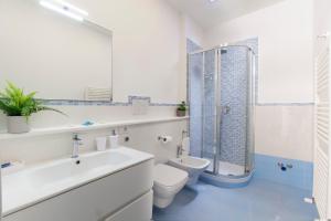 a bathroom with a sink toilet and a shower at Estate4home - Casa Rosangela in Sorrento +36 photos
