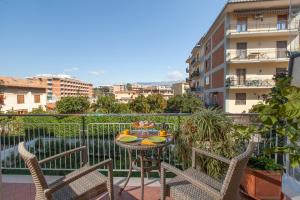 a balcony with a table and chairs on a balcony at Estate4home - Casa Rosangela in Sorrento