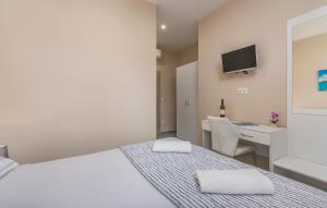 Postel nebo postele na pokoji v ubytování Roberto rooms