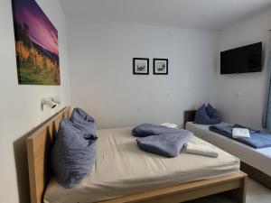 Postel nebo postele na pokoji v ubytování VilLa AdeLe
