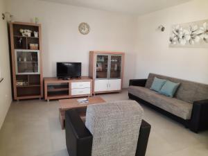 a living room with a couch and a coffee table at Apartment Juliette in Zadar