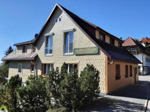 a building with a sign on the side of it at Gästehaus Wissler in Todtnau