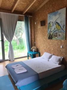 Ein Bett oder Betten in einem Zimmer der Unterkunft Biovilla Sustentabilidade