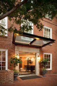 a glass door into a brick building at The Graham Georgetown in Washington