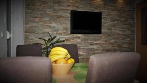 Televízia a/alebo spoločenská miestnosť v ubytovaní Apartment Adriatic