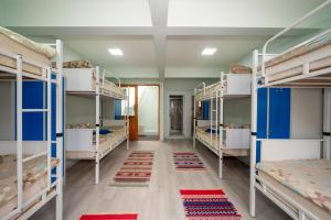 A bed or beds in a room at XALİLA HOSTEL & CAFE LADİES ROOM