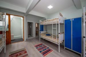 A bed or beds in a room at XALİLA HOSTEL & CAFE LADİES ROOM