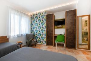 Postel nebo postele na pokoji v ubytování Gu Hotel
